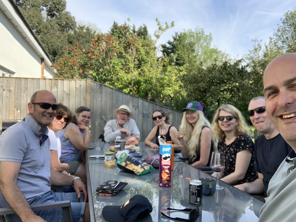 Connect Church members sharing a meal together around a garden table